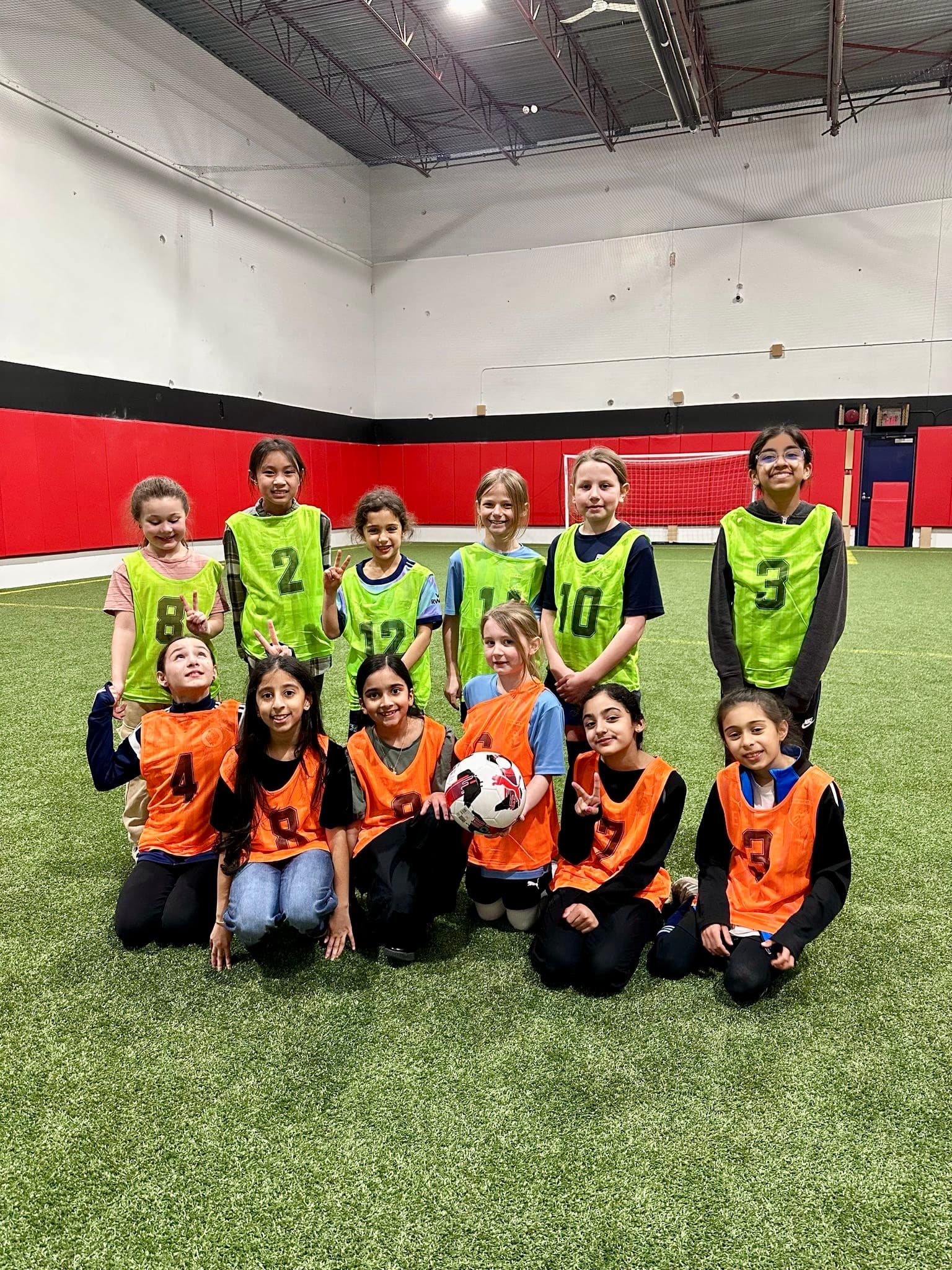 Kids on the indoor turf field at a Full 90 birthday party