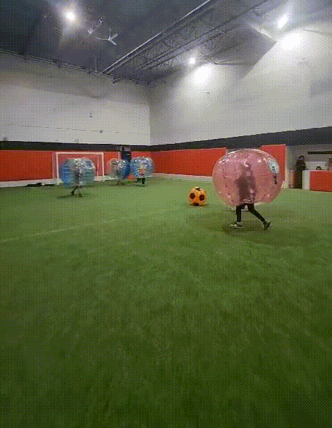 Kids playing bubble soccer at Full 90